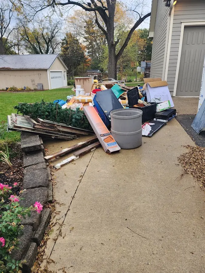 Dumpster being loaded with debris for 12 Yard Dumpster Rental in Fairfield